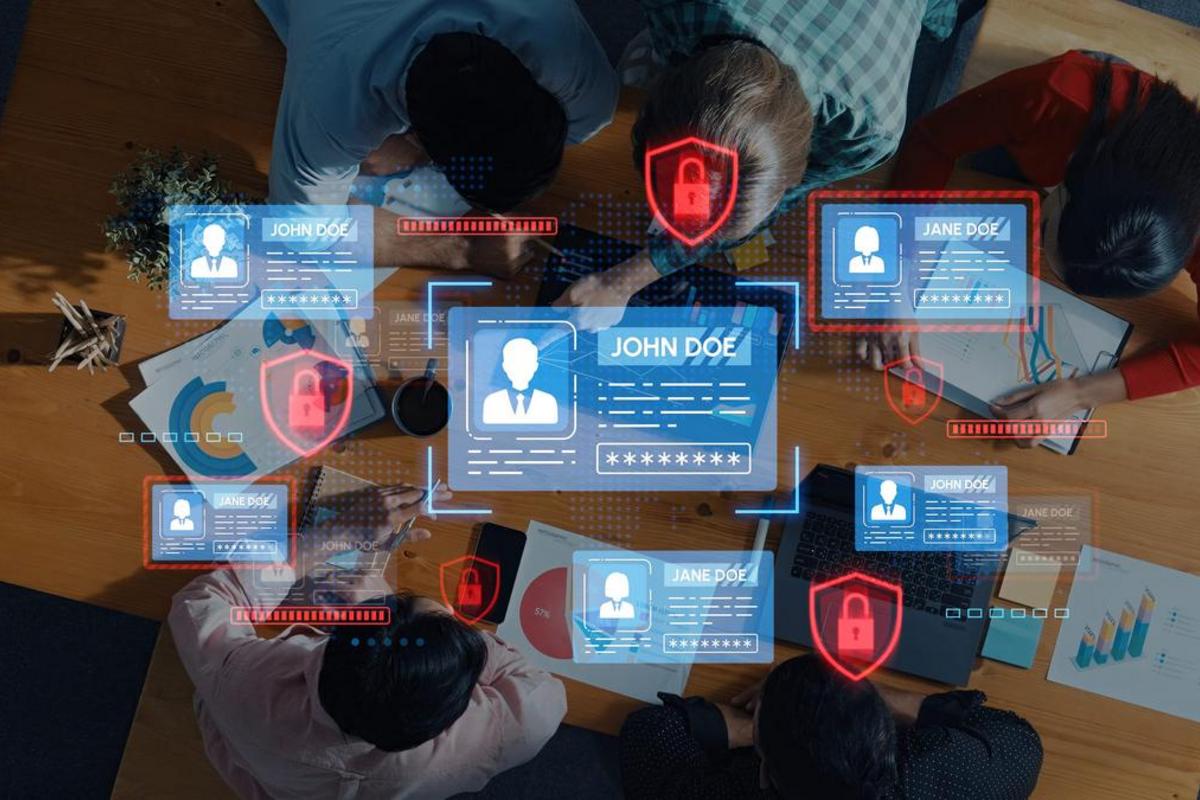 Office team meeting with client record cards and padlock icons over their documents.