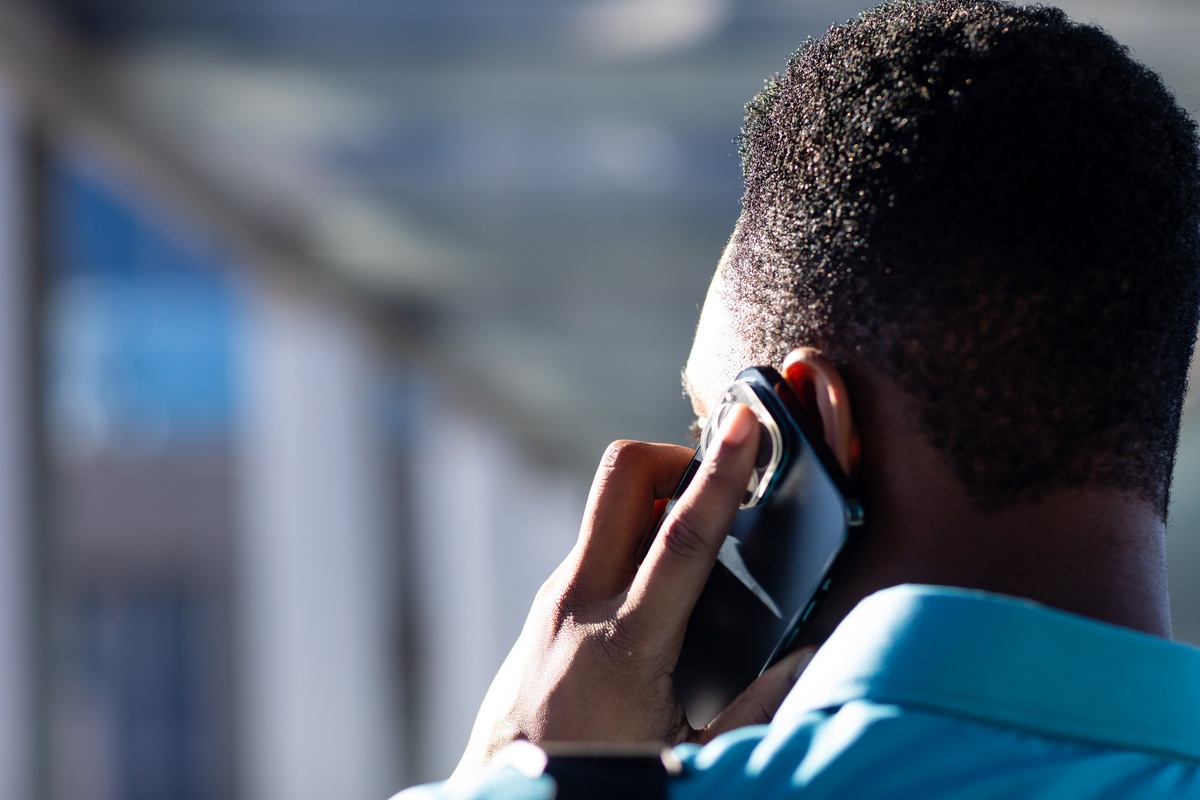 Man using mobile phone.
