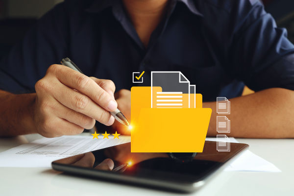 Businessman using tablet with icons about business and electronic documents